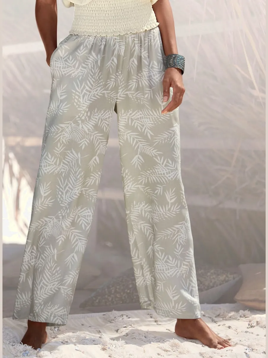 Pantalon large en viscose crêpée avec ceinture smockée et poches latérales