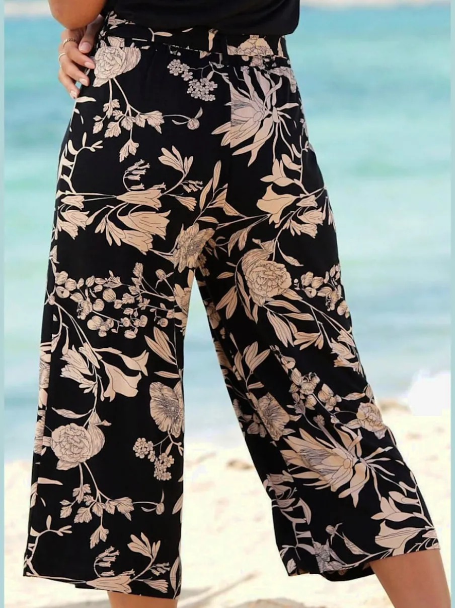 Pantalon large jupe-culotte à motif floral avec ceinture