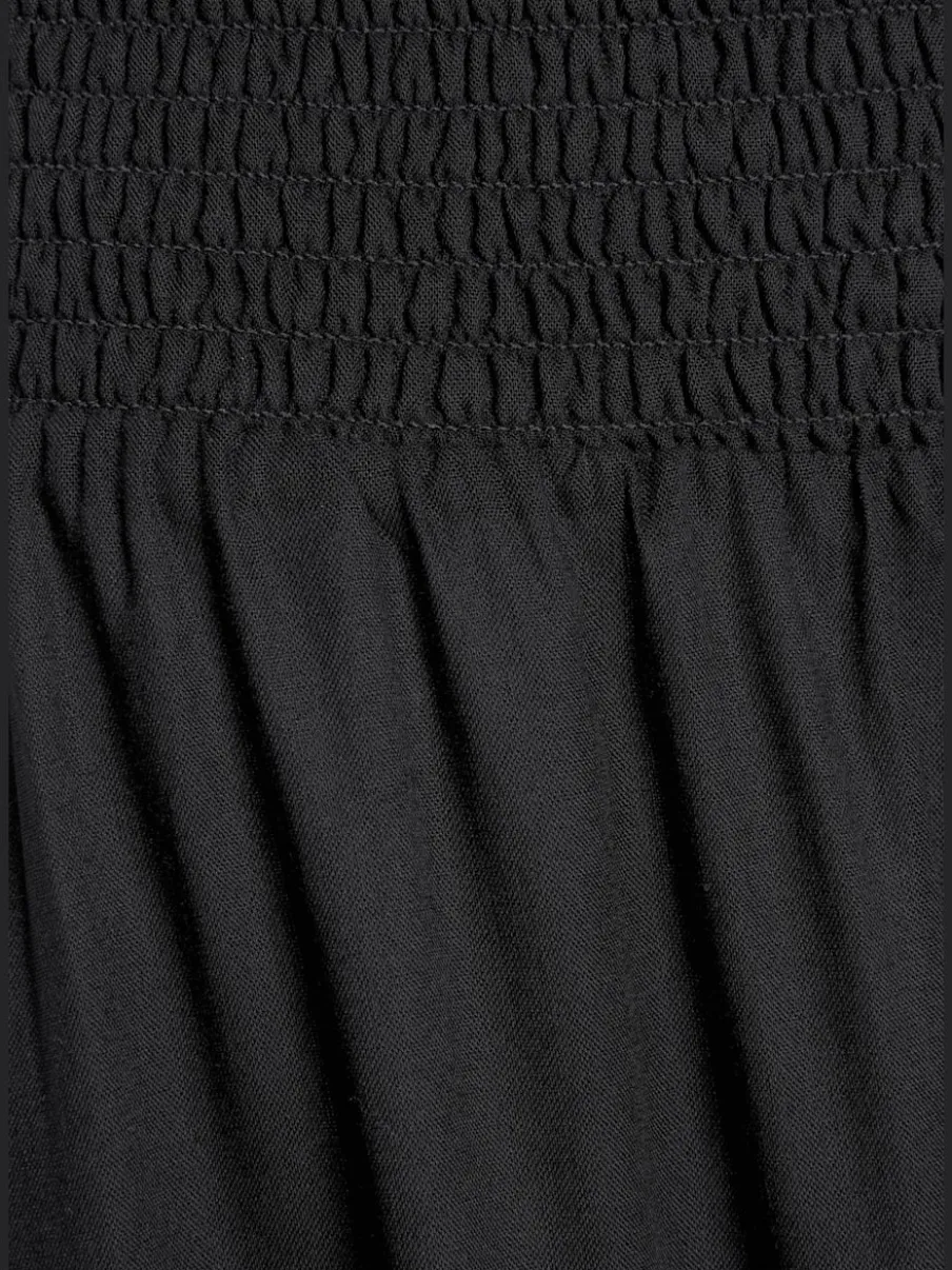 Pantalon léger à large ceinture avec fentes arrondies