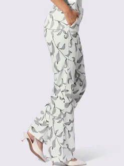 Pantalon légèrement évasé à motif floral avec poches