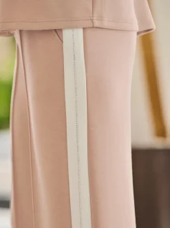 Pantalons en jersey confortables avec rayures et pierres brillantes