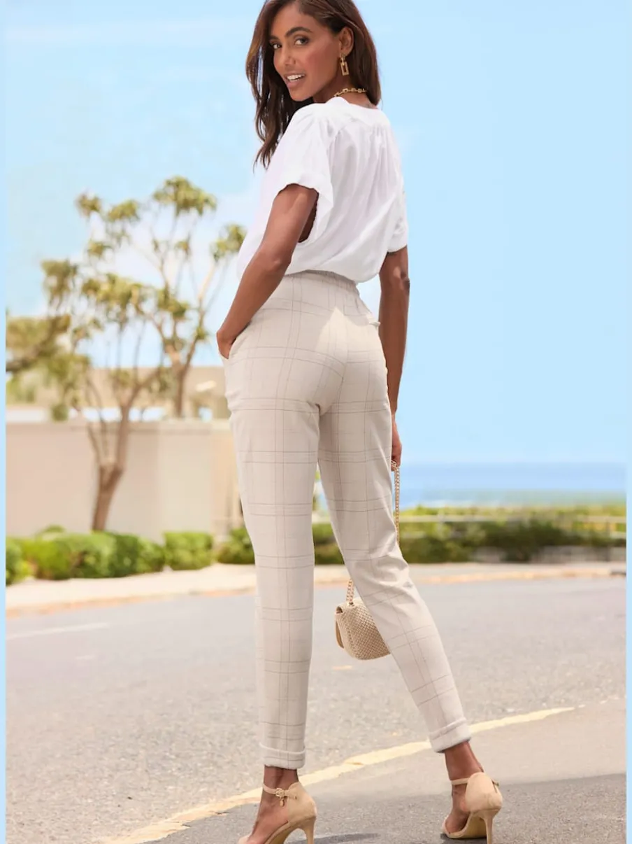 Pantalons extensibles avec ceinture coulissée et motifs à carreaux