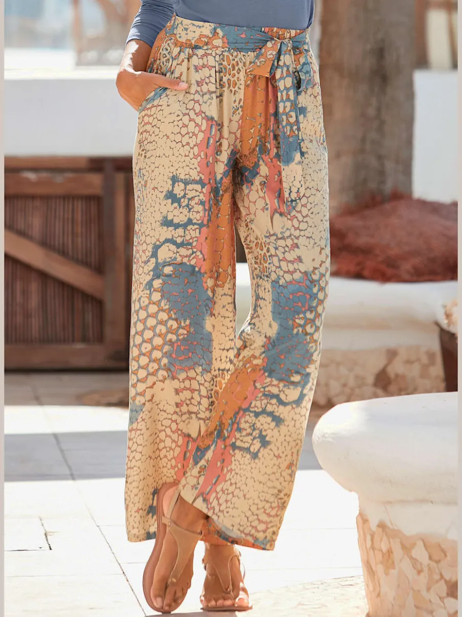 Pantalons fluides avec motifs et ceinture à nouer