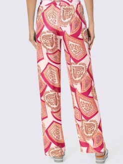Pantalons fluides à l'imprimé extravagant avec poches