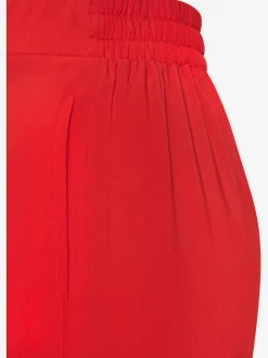 Pantalons fluides à poches latérales et taille élastiquée
