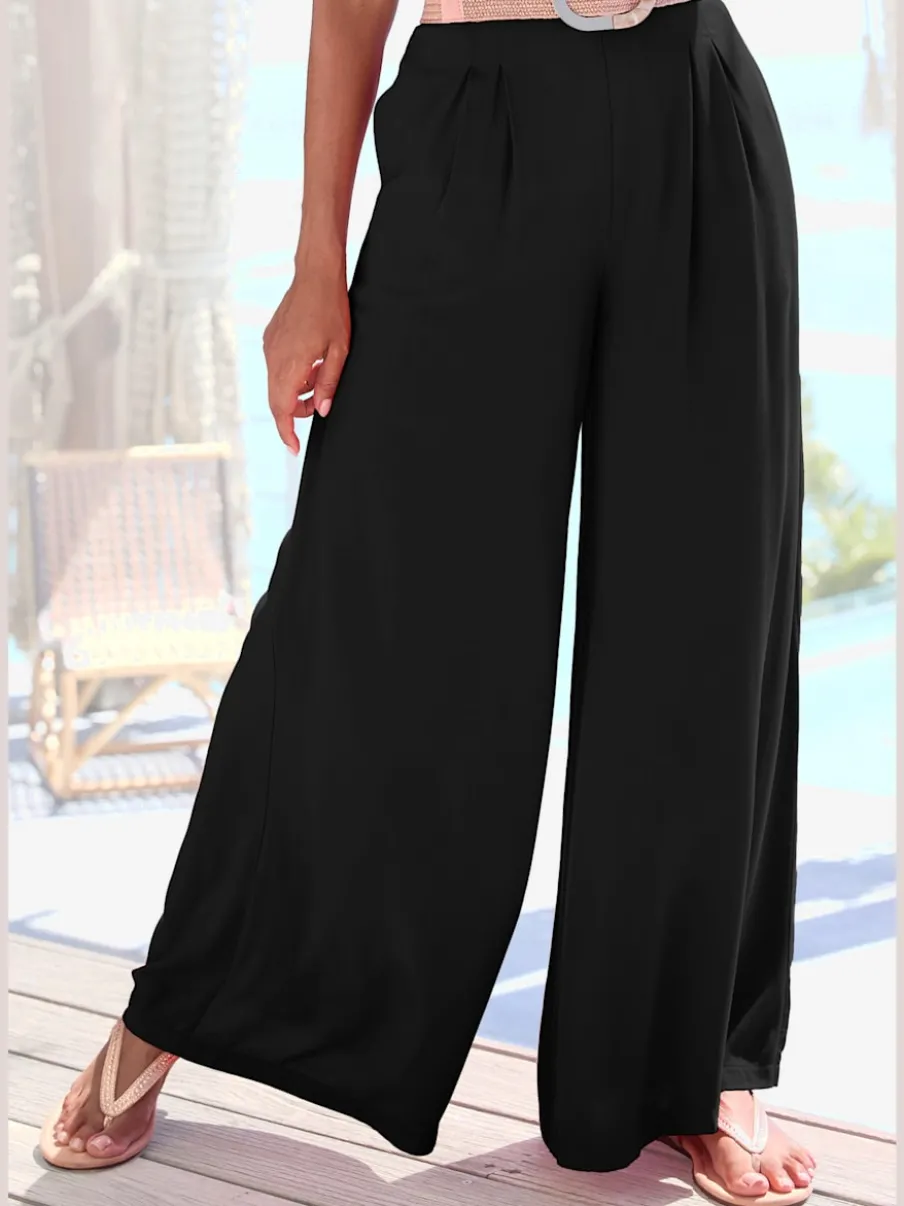 Pantalons fluides à poches latérales et taille élastiquée