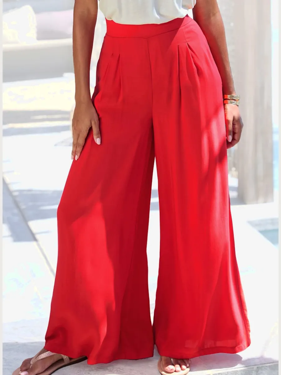 Pantalons fluides à poches latérales et taille élastiquée