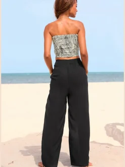 Pantalons larges en viscose avec poches latérales fendues