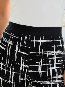Pantalons 7/8 motifs graphiques avec poches et fentes