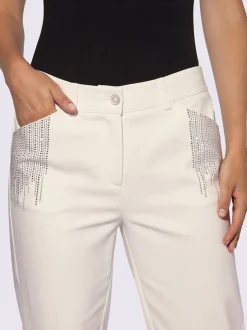 Pantalons près du corps avec petites pierres brillantes