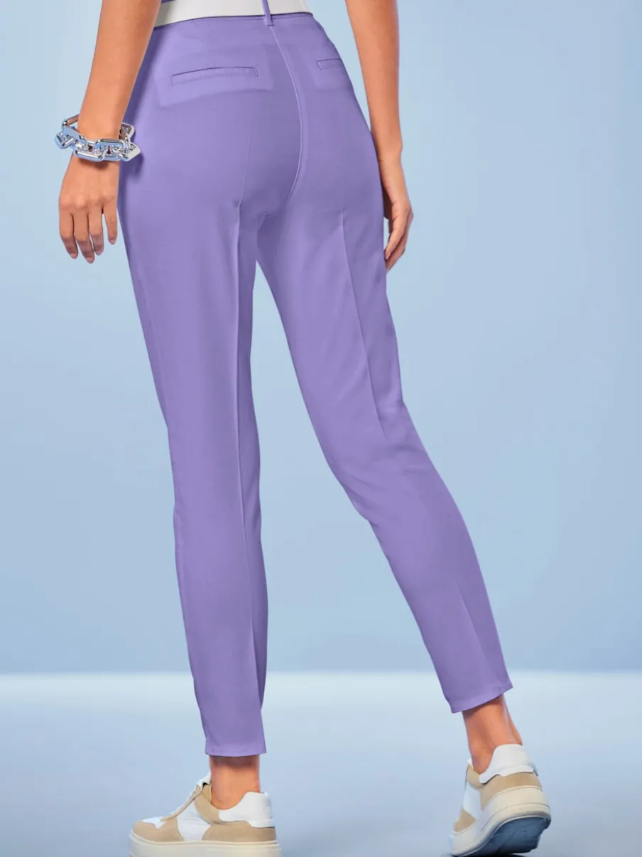 Pantalons skinny extensibles avec poches décoratives et fente
