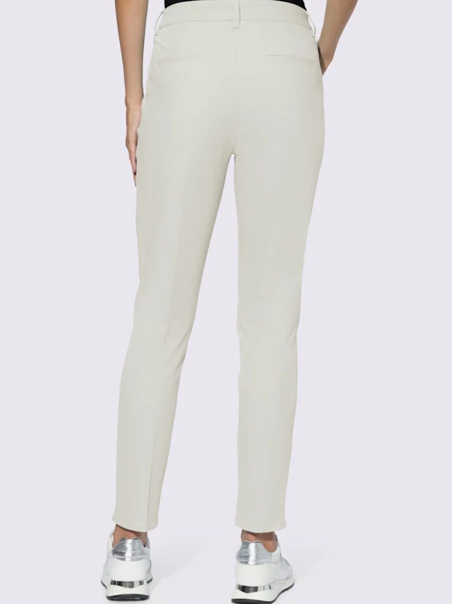 Pantalons skinny extensibles avec poches décoratives et fente