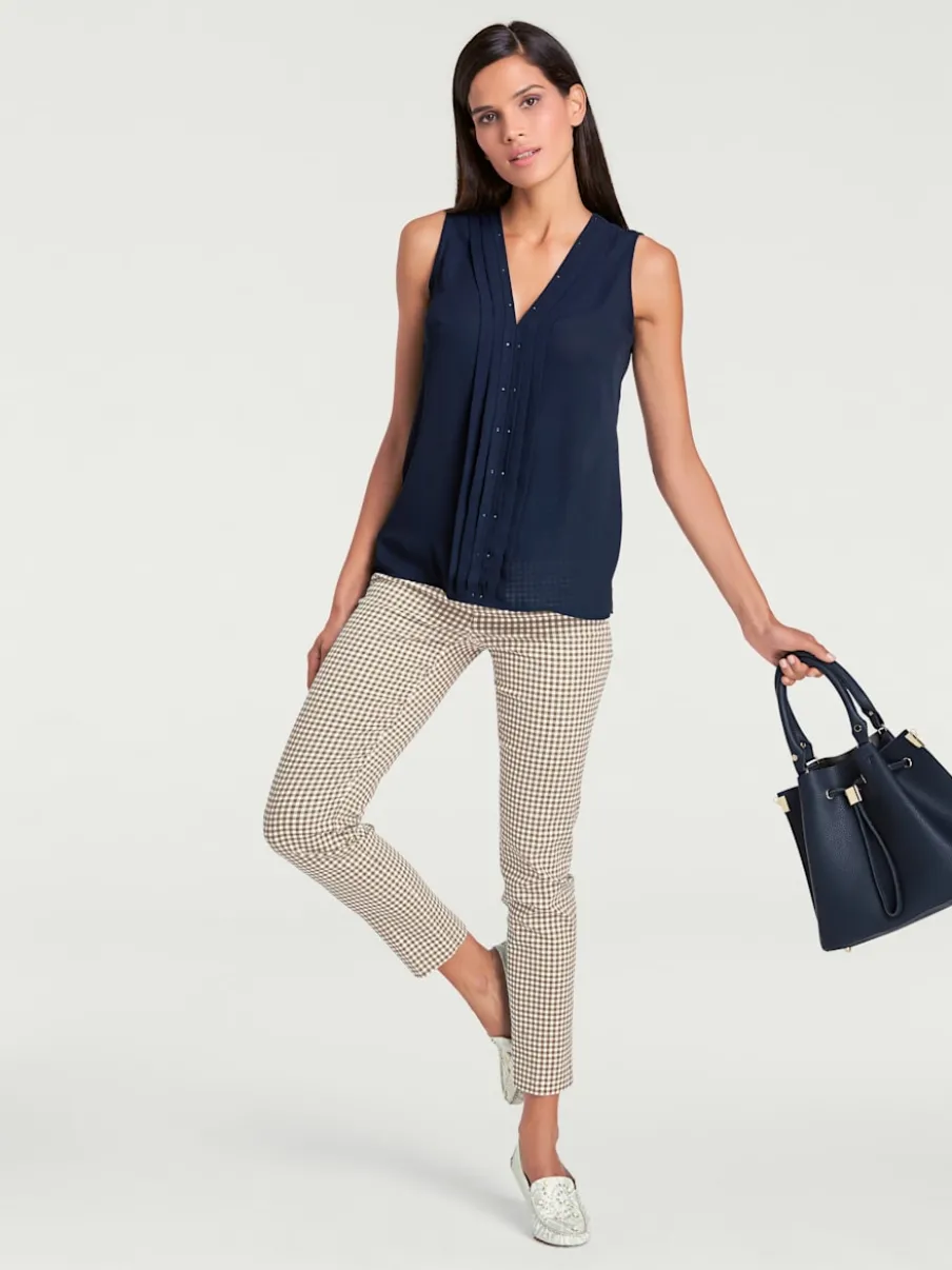 Pantalons skinny à poches fendues et motif géométrique