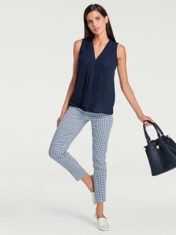 Pantalons skinny à poches fendues et motif géométrique