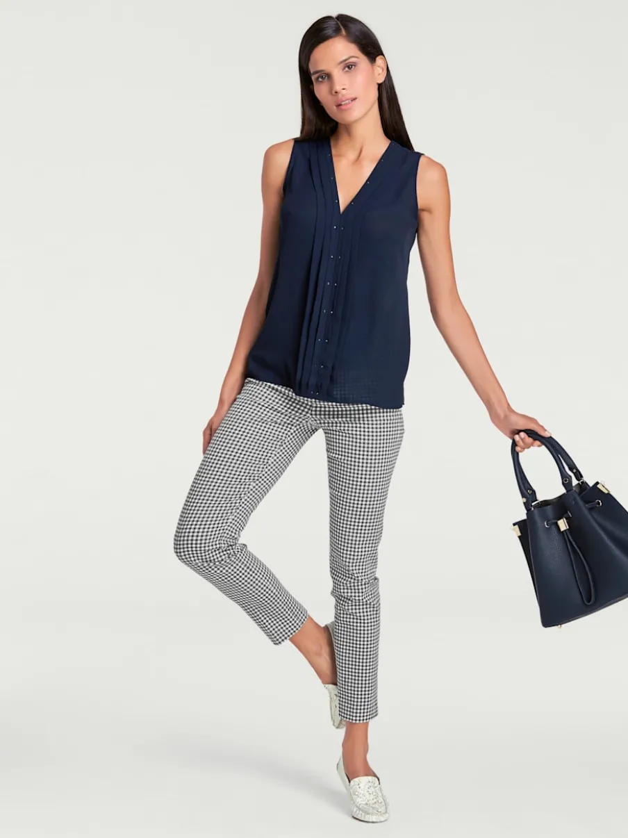 Pantalons skinny à poches fendues et motif géométrique