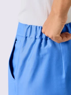 Pantalons tailleurs en soie avec poches et fermeture discrète