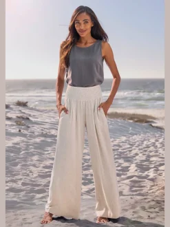Pantalon structuré à ceinture smockée et poches latérales