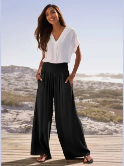 Pantalon structuré à ceinture smockée et poches latérales