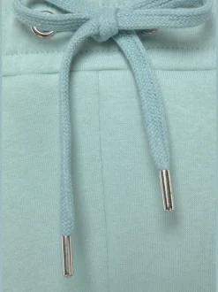 Pantalon sweat avec logo brodé et poches latérales fendues