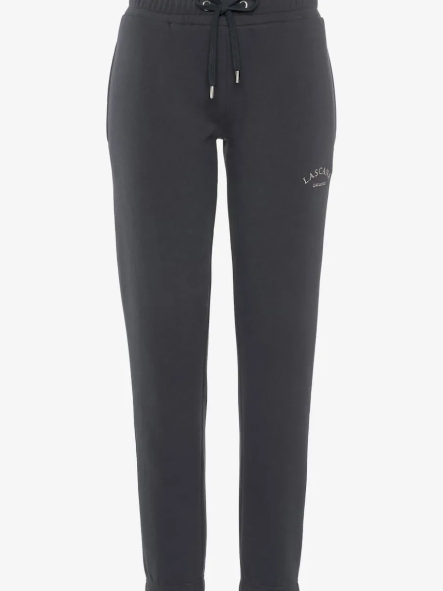 Pantalon sweat avec logo brodé et poches latérales fendues
