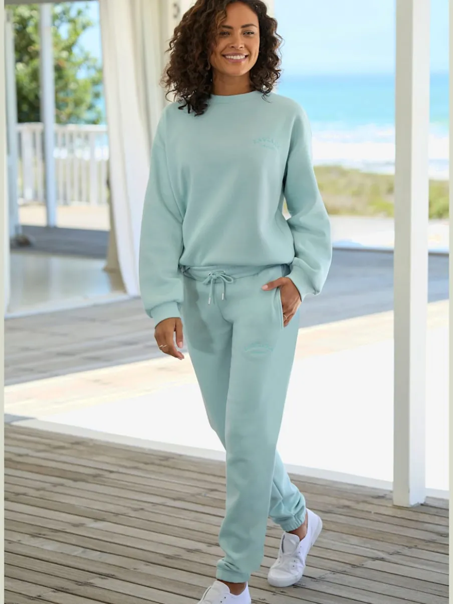Pantalon sweat avec logo brodé et poches latérales fendues