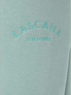 Pantalon sweat avec logo brodé et poches latérales fendues