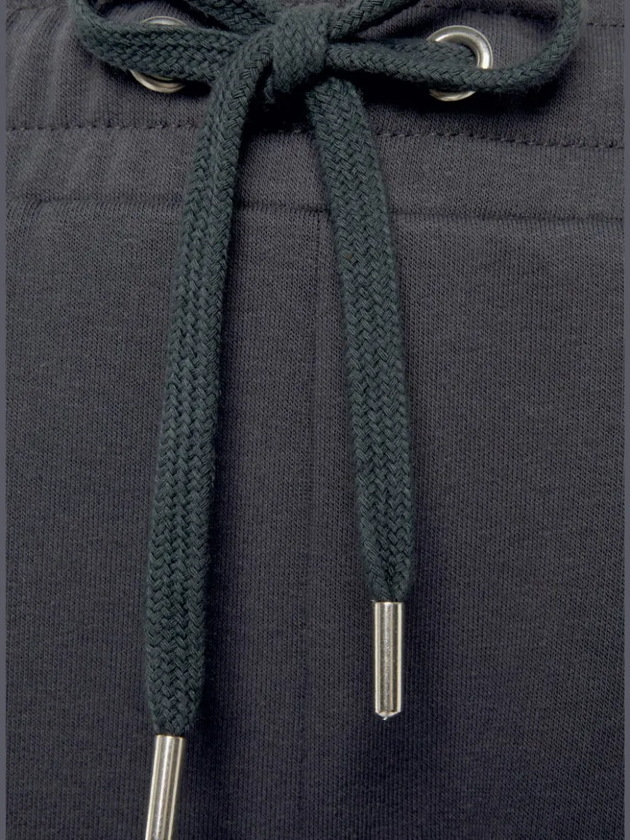 Pantalon sweat avec logo brodé et poches latérales fendues