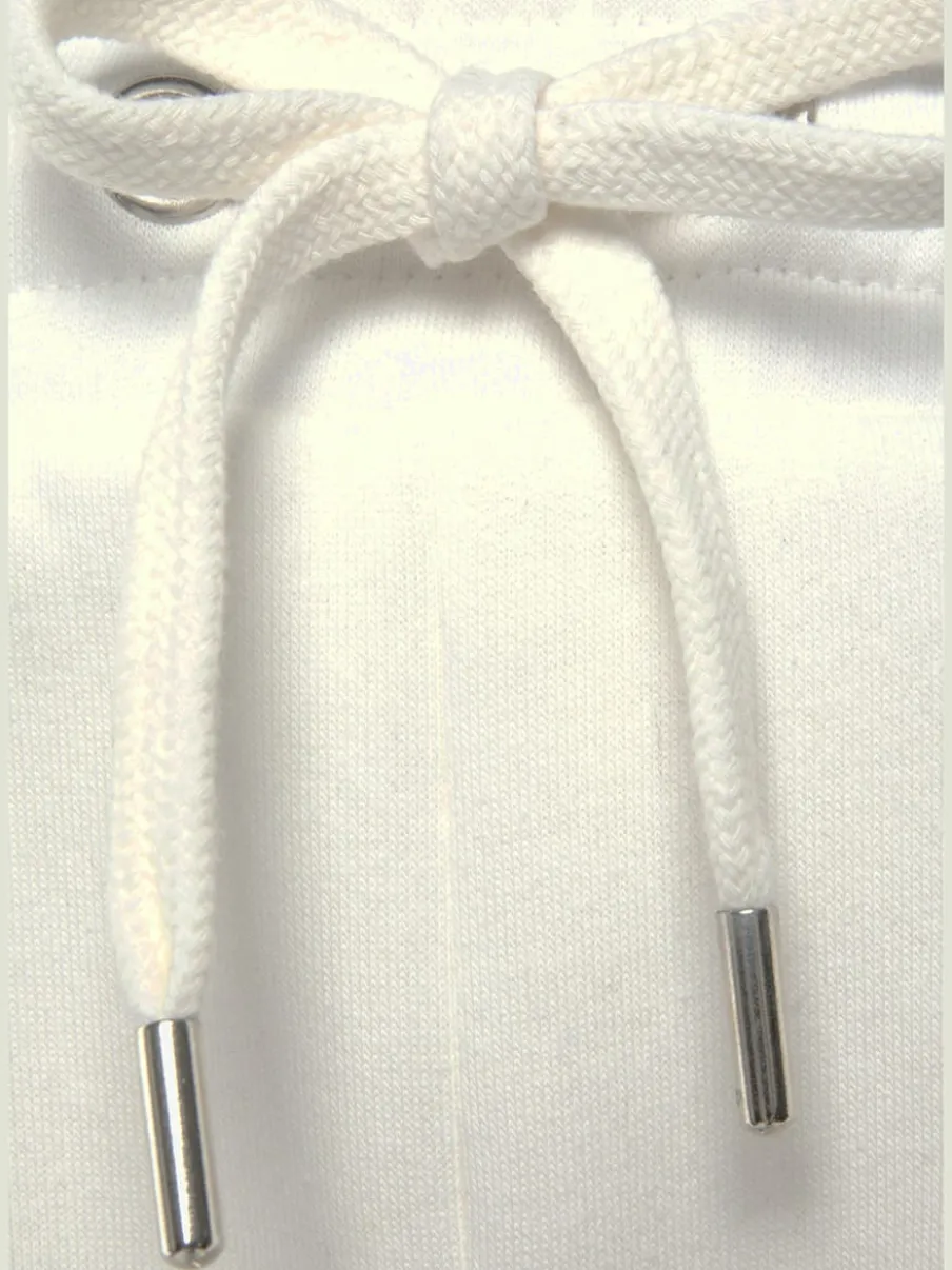 Pantalon sweat avec logo brodé et poches latérales fendues
