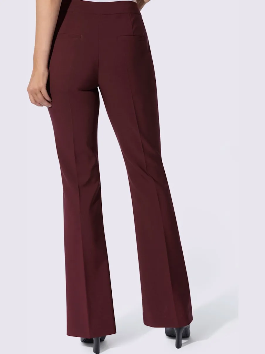 Pantalon tailleur avec nervures et poches latérales