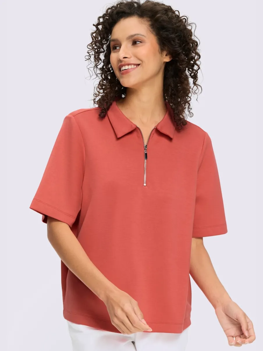 Polo à col zippé en mélange de matières douces et manches courtes