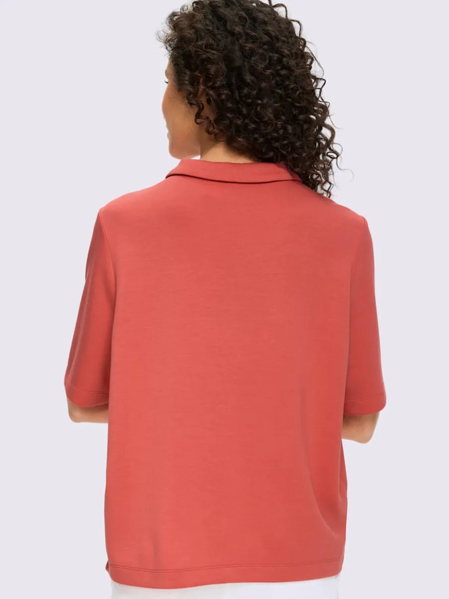 Polo à col zippé en mélange de matières douces et manches courtes