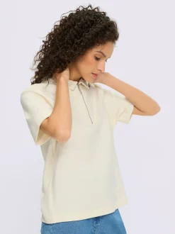 Polo à col zippé en mélange de matières douces et manches courtes