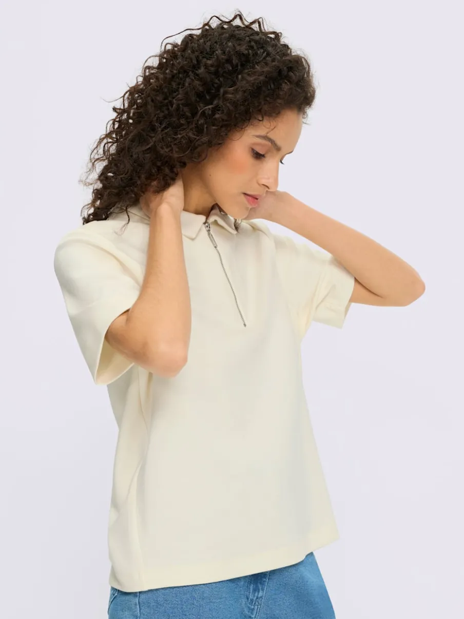 Polo à col zippé en mélange de matières douces et manches courtes
