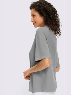 Polo à col zippé en mélange de matières douces et manches courtes