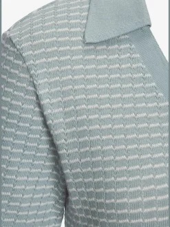 Polo en tricot à col V et manches courtes avec joli motif bicolore