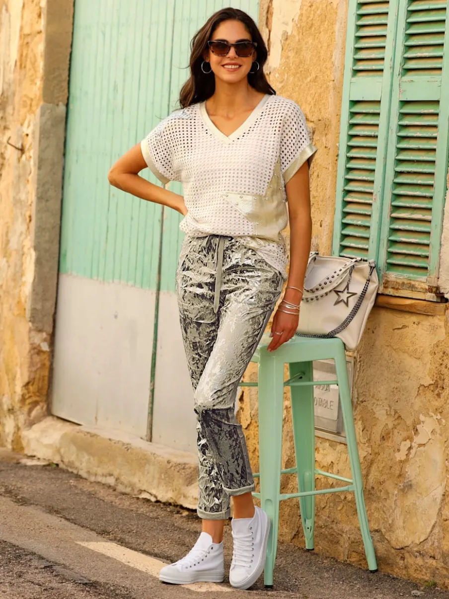 Pull ajouré avec col en V et manches courtes à motif ajouré