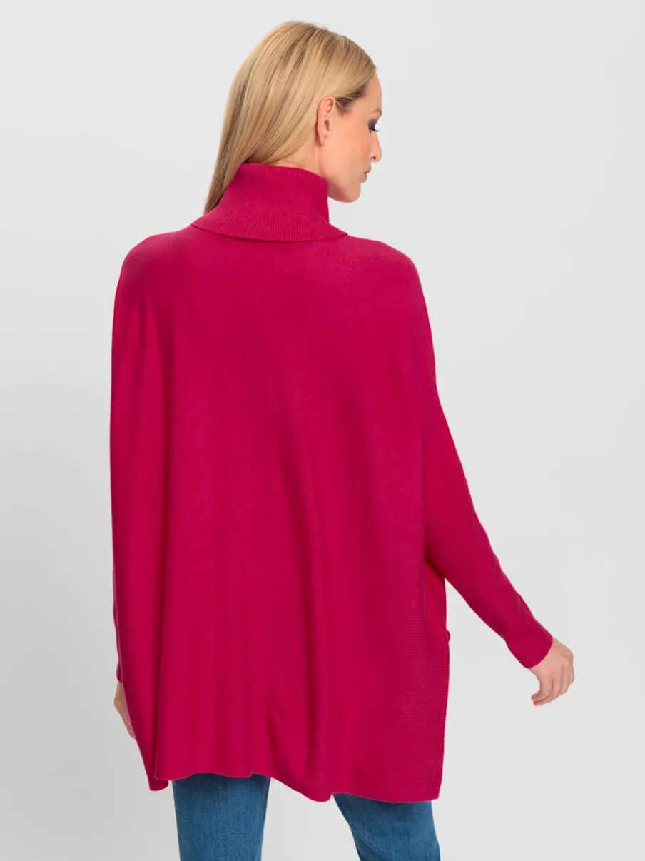 Pull ample à col roulé avec poches décoratives boutons