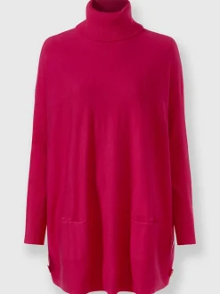 Pull ample à col roulé avec poches décoratives boutons