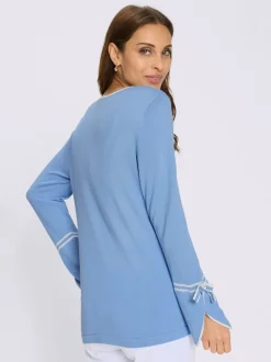 Pull au col rond avec finitions élégantes et doux nœuds