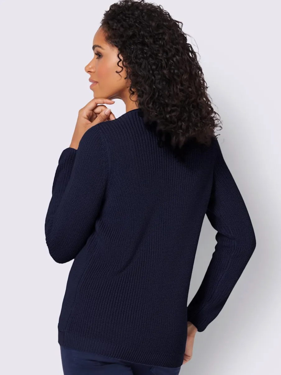 Pull avec boutonnières avant à effet affinant et côtelé