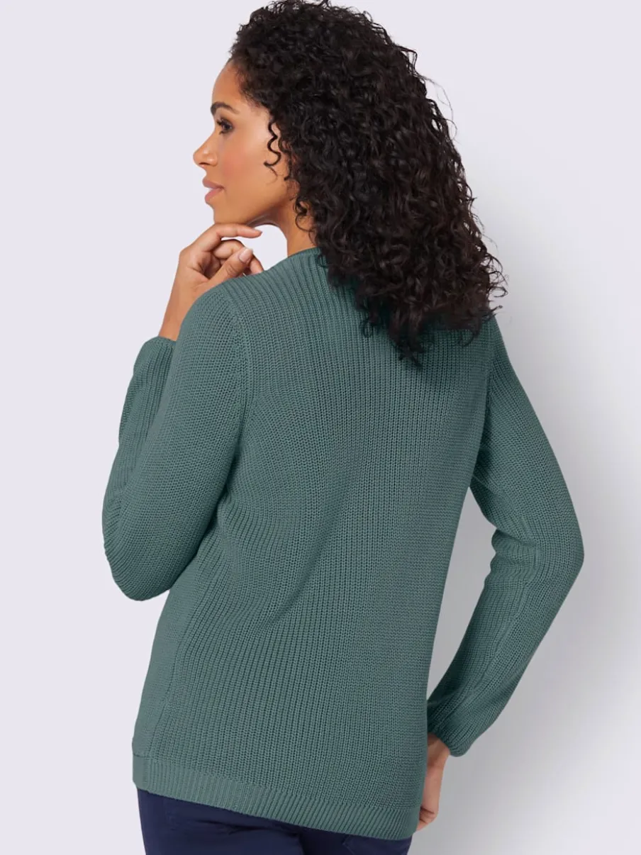 Pull avec boutonnières avant à effet affinant et côtelé