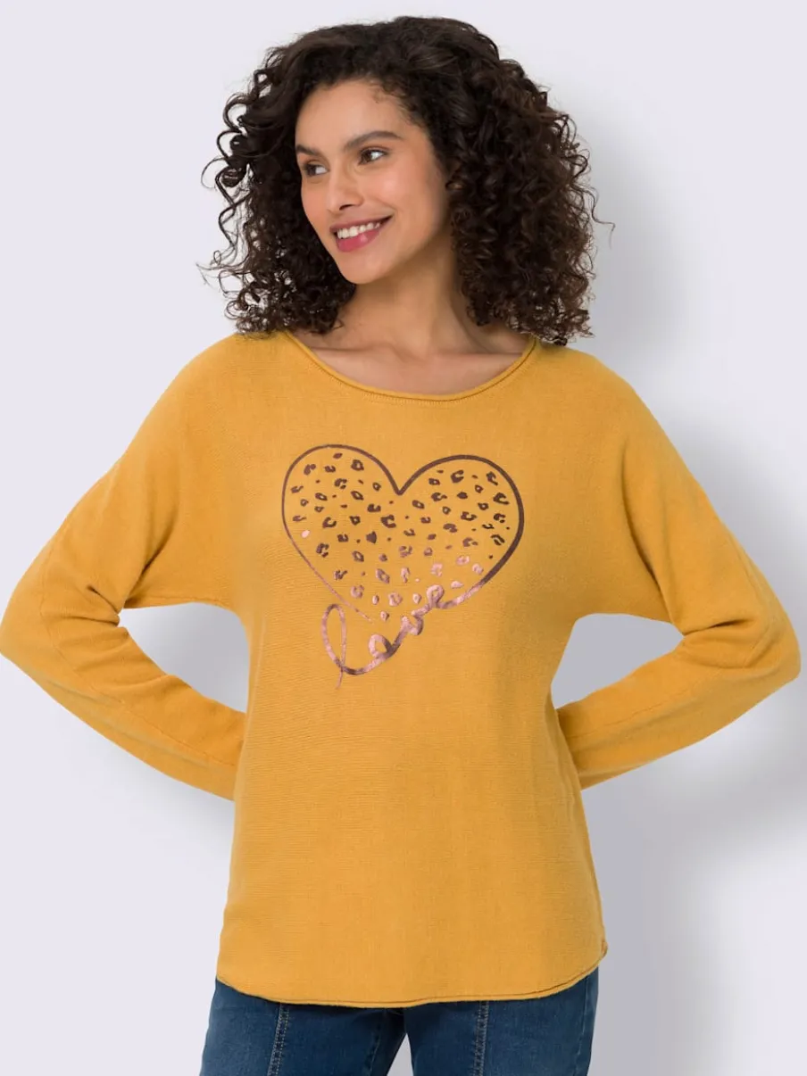 Pull chauve-souris doux avec motif cœur brillant
