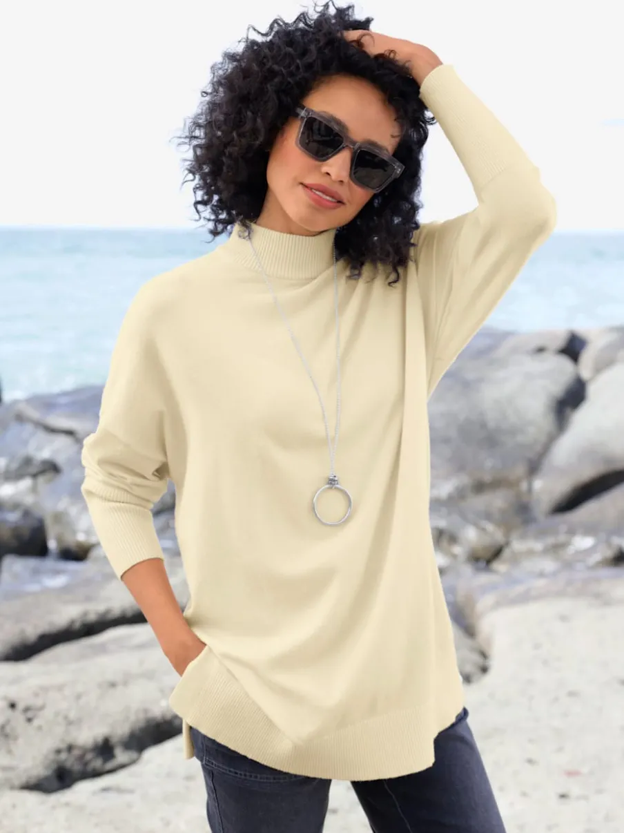 Pull à col montant avec boutons décoratifs au dos