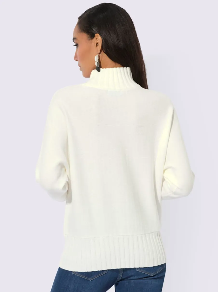 Pull à col montant avec manches chauve-souris et ornements