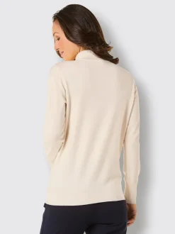 Pull à col montant à volants raffinés et finition soignée