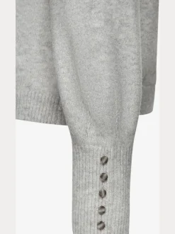 Pull col rond avec manches longues et boutons doux