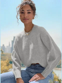 Pull col rond avec manches longues et boutons doux
