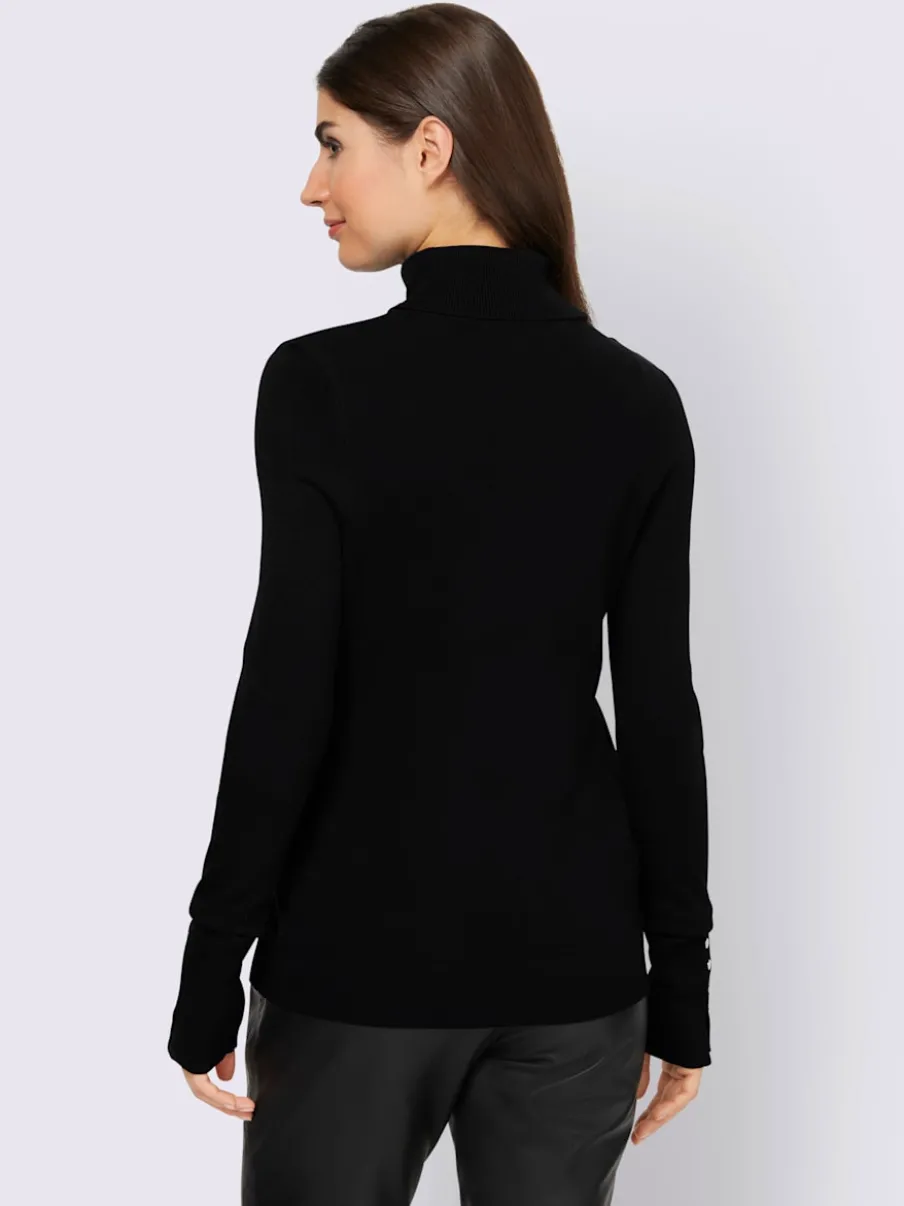 Pull à col roulé avec manches longues et boutons décoratifs