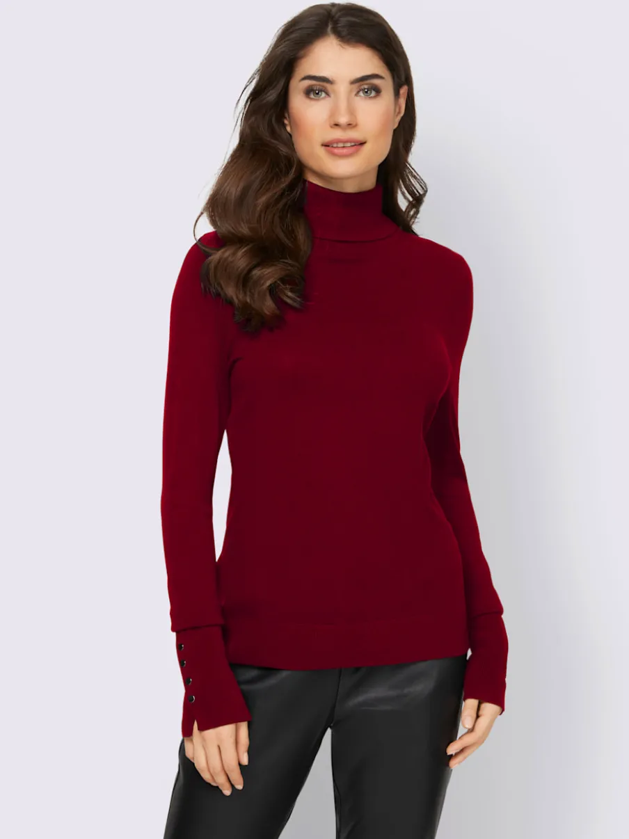 Pull à col roulé avec manches longues et boutons décoratifs