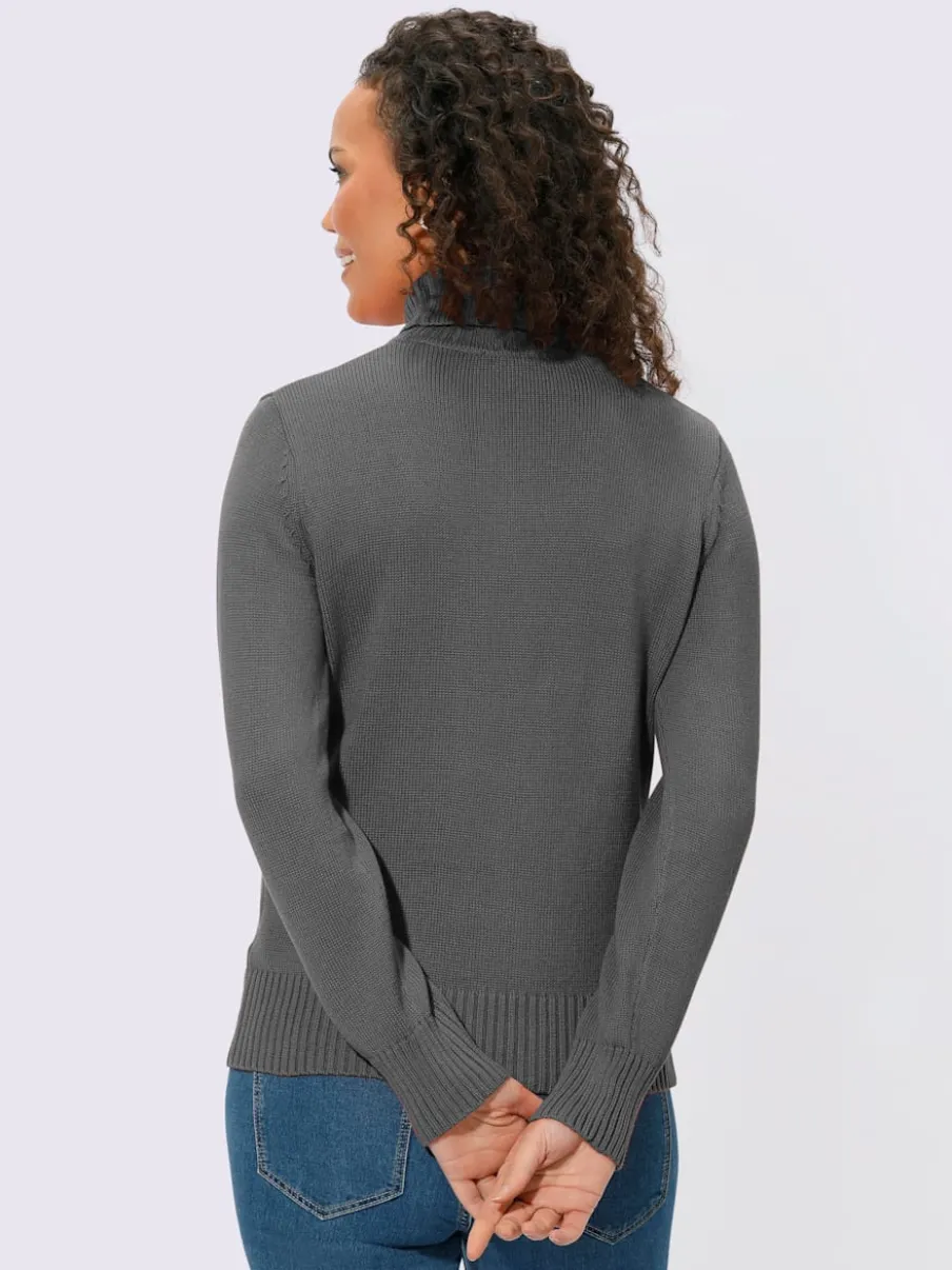 Pull col roulé à emmanchures diminuées finitions côtelées